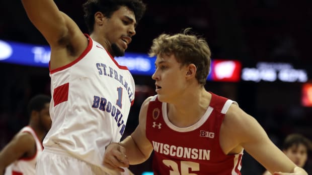 Wisconsin forward Markus Ilver backing his man down against Saint Francis of Brooklyn.